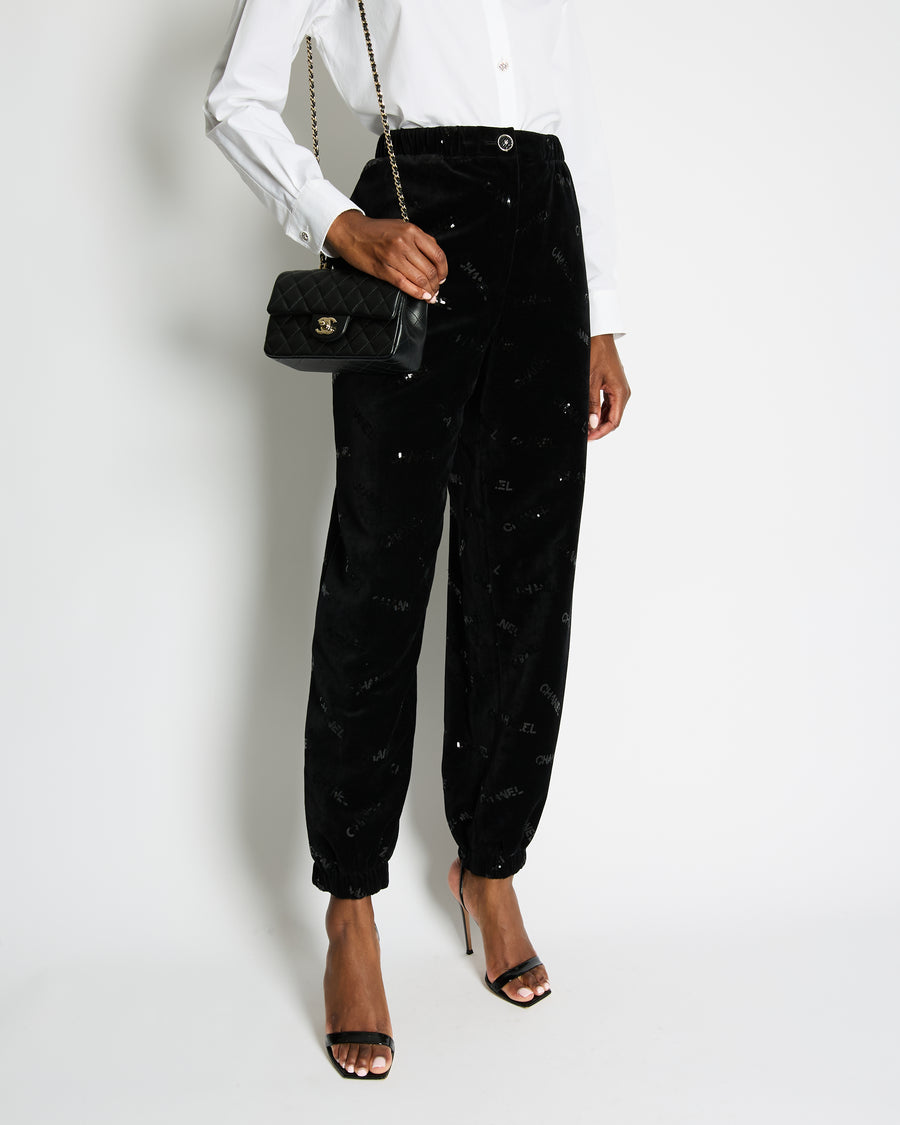 Chanel 22B Black Velvet Jogging Pants with Sequin Chanel Logo Detail Size FR 42 (UK 14)