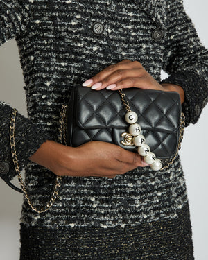 Chanel Black Quilted Lambskin Small Single Flap Bag with Pearl Logo Chain Detailing and Champagne Hardware