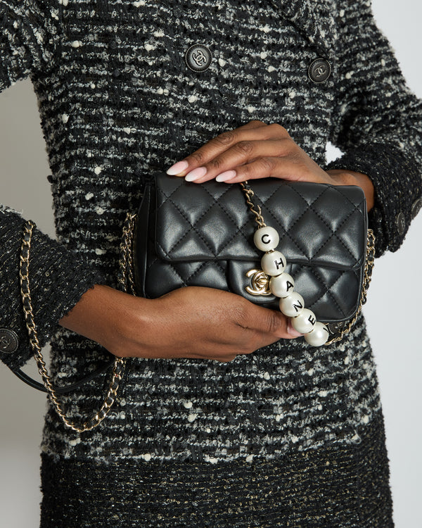 Chanel Black Quilted Lambskin Small Single Flap Bag with Pearl Logo Chain Detailing and Champagne Hardware