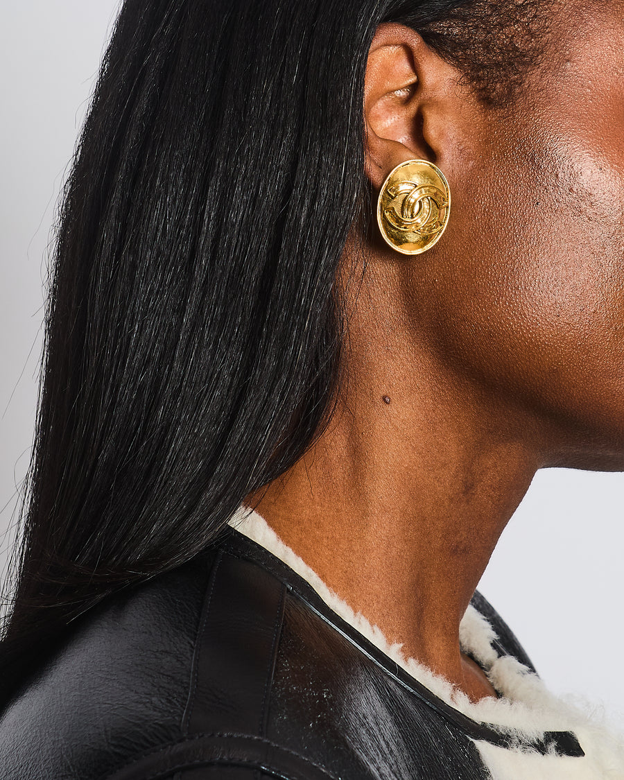 Chanel Vintage 94P Gold Polished Oval Clip On Earrings with CC Logo