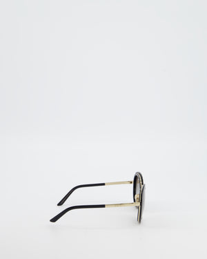Prada Black Oval Sunglasses with Black Acetate Frames and Gradient Lenses