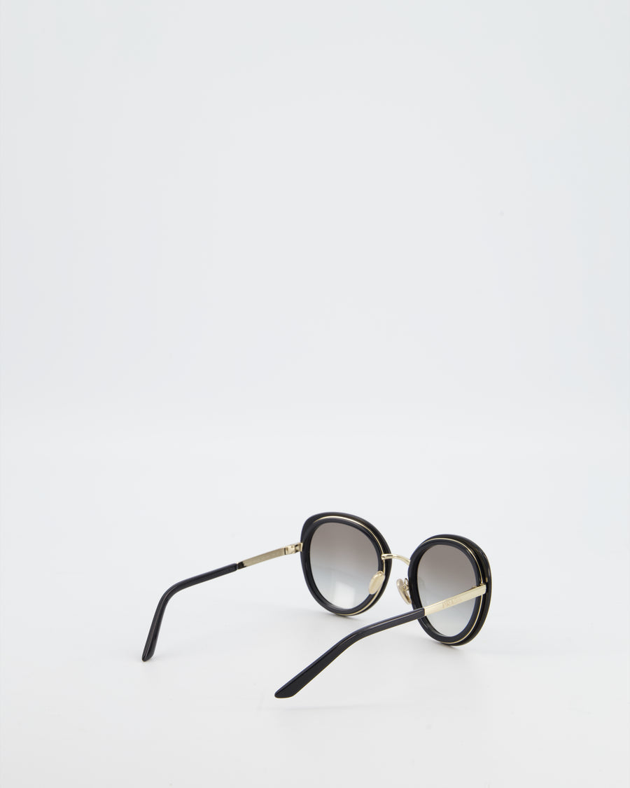 Prada Black Oval Sunglasses with Black Acetate Frames and Gradient Lenses