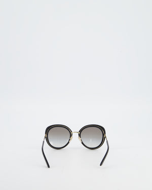 Prada Black Oval Sunglasses with Black Acetate Frames and Gradient Lenses