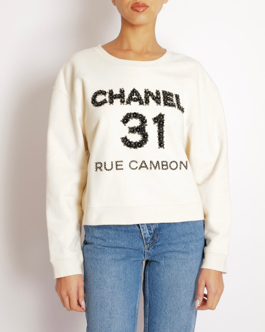 Chanel Beige 31 Rue Cambon Sweater with Black Floral Appliqué Logo Size L (UK 12)