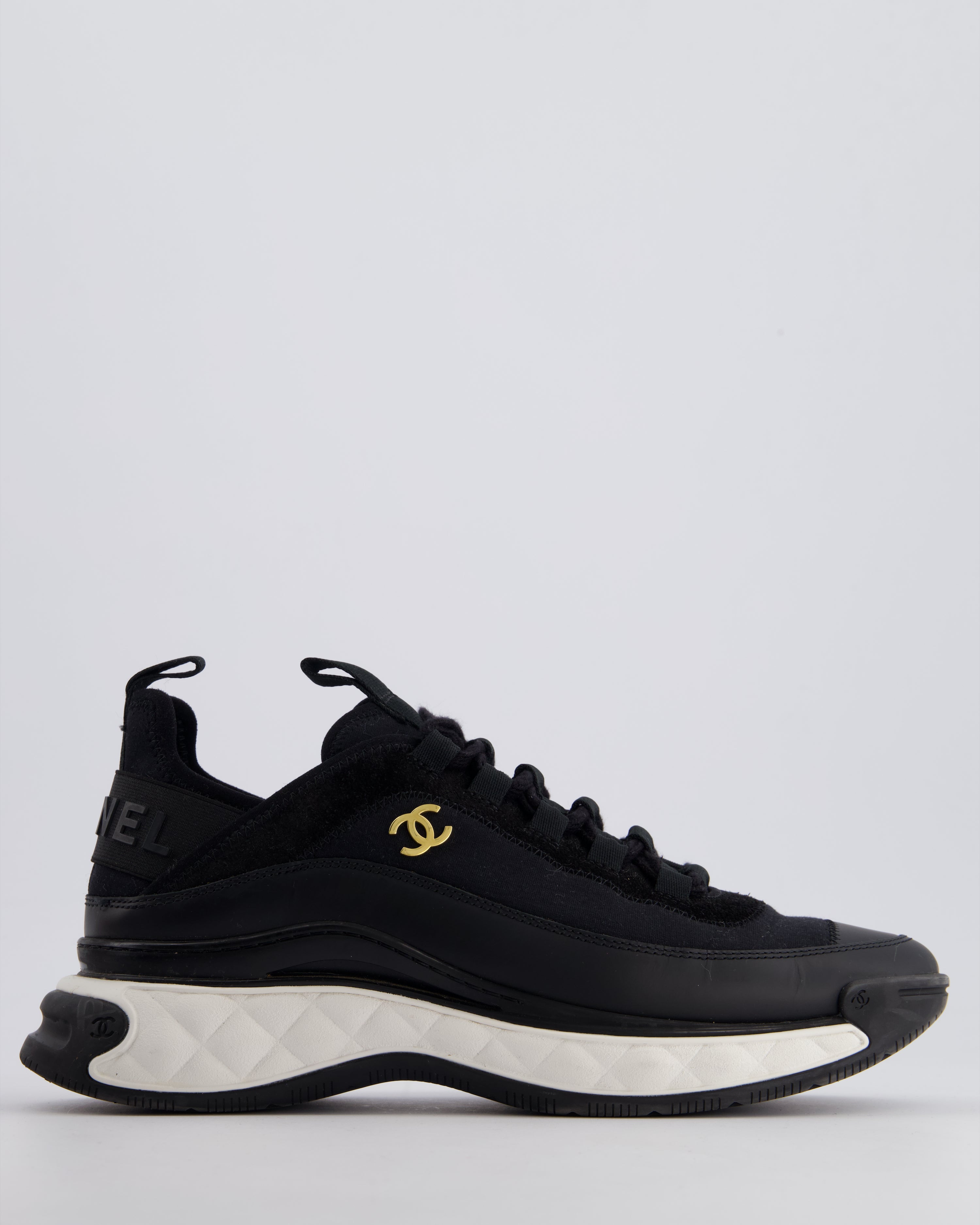 black and gold chanel trainers