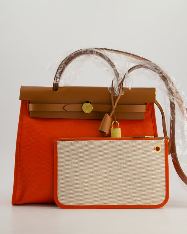 *HOT & RARE* Hermès Herbag 31 in Orange Mécano Berlin Coated Canvas, Fauve Vache Hunter Leather and Ecrù Toile H Canvas with Gold Hardware