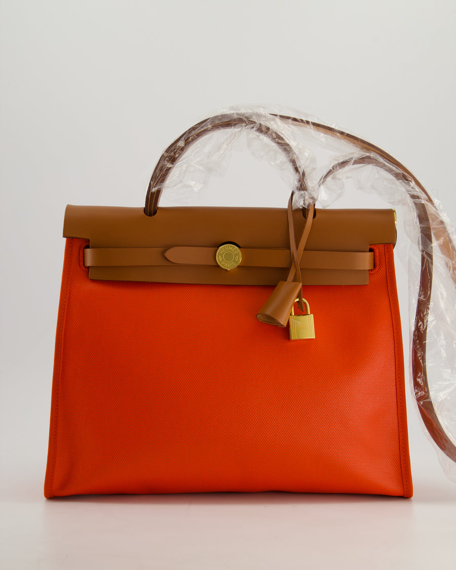*HOT & RARE* Hermès Herbag 31 in Orange Mécano Berlin Coated Canvas, Fauve Vache Hunter Leather and Ecrù Toile H Canvas with Gold Hardware