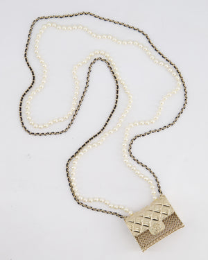 Chanel 21S Champagne Gold Bag Charm Necklace with White Pearls & Black Leather Chain Detail