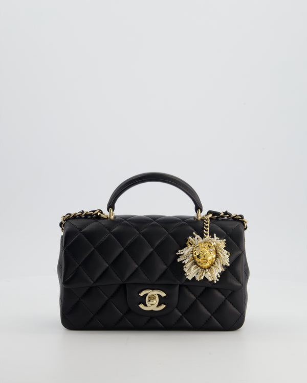 Chanel Black Mini Rectangular Top Handle Flap Bag in Lambskin Leather with Champagne Hardware and Pearl Crystal Lion Charm