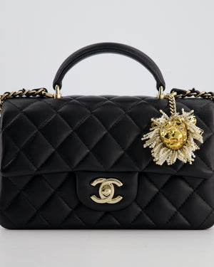 Chanel Black Mini Rectangular Top Handle Flap Bag in Lambskin Leather with Champagne Hardware and Pearl Crystal Lion Charm