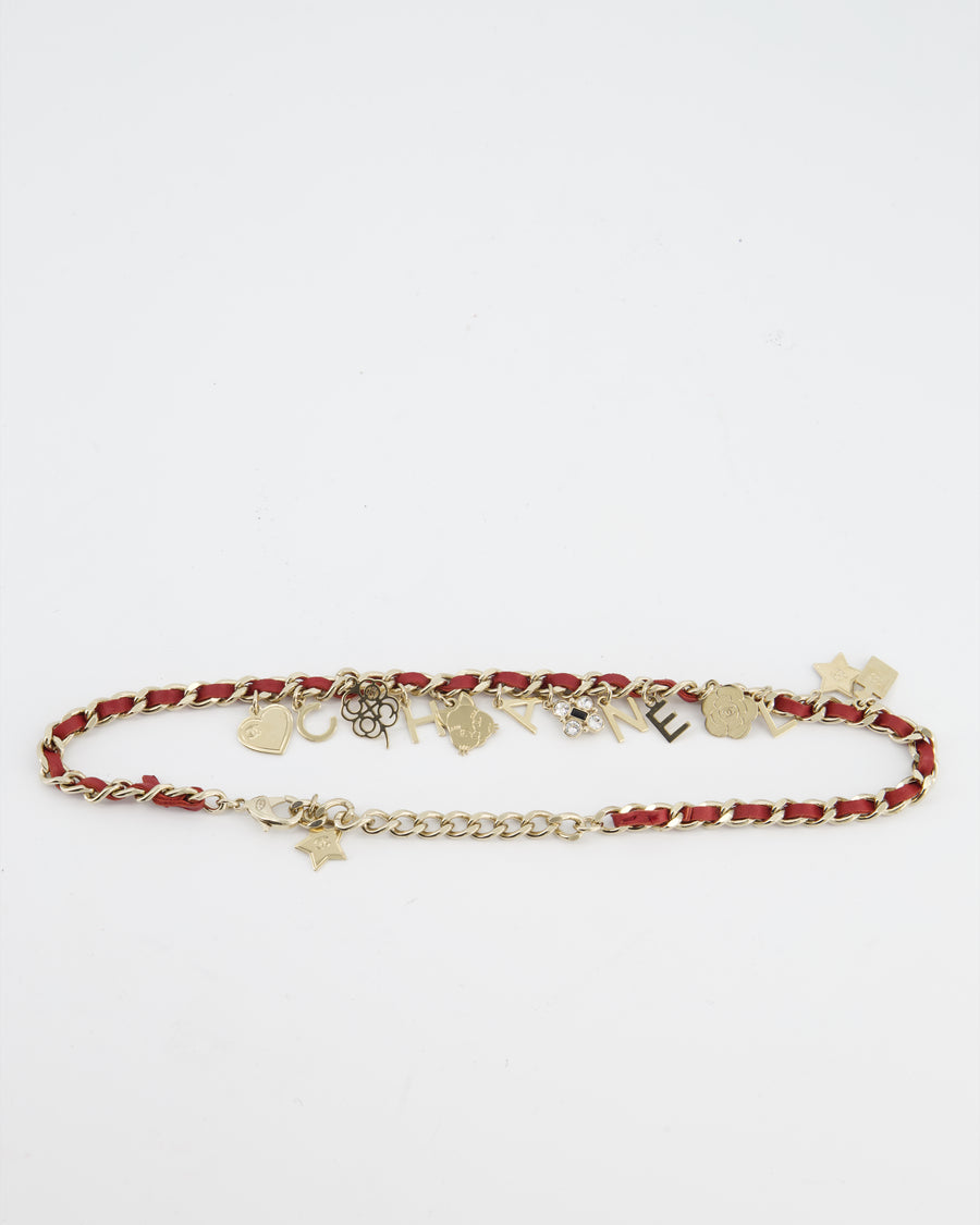 Chanel Necklace with a Red Leather-Woven Chain and Multiple Gold Charms