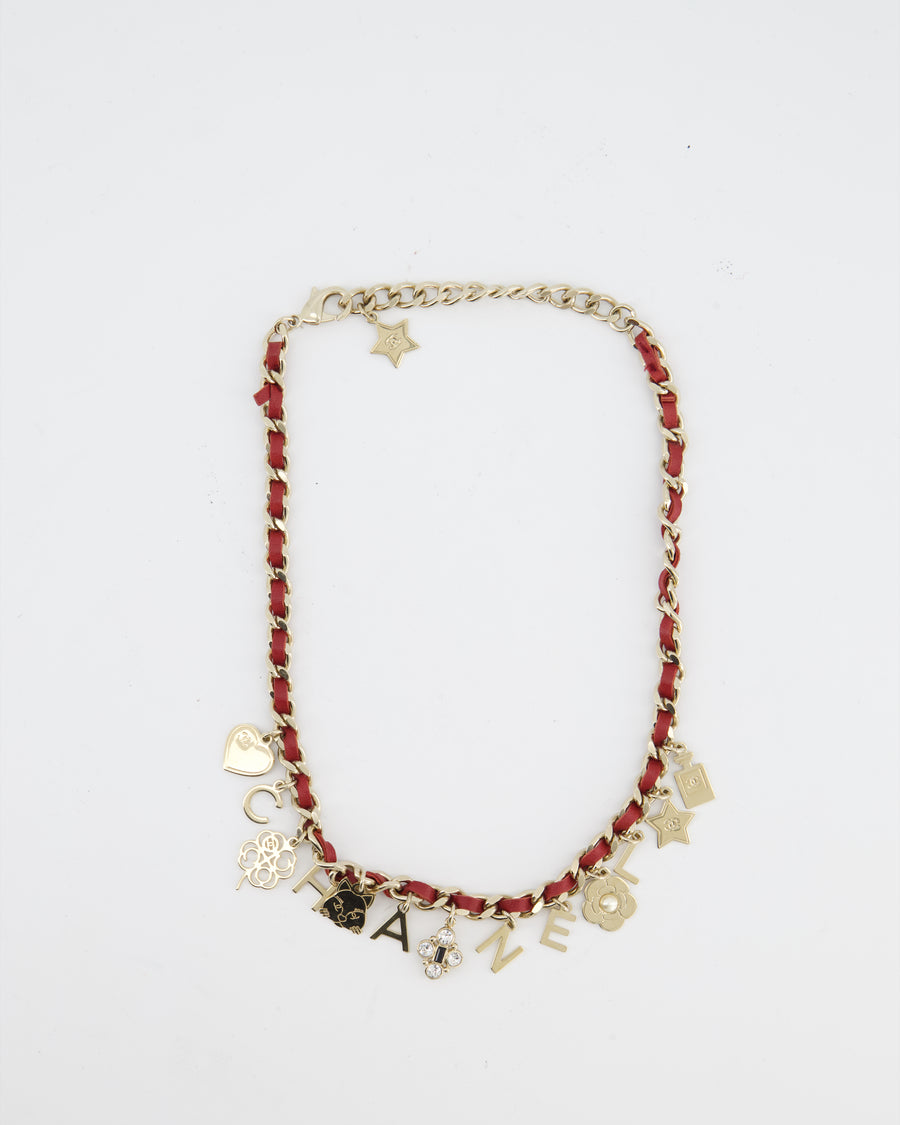 Chanel Necklace with a Red Leather-Woven Chain and Multiple Gold Charms