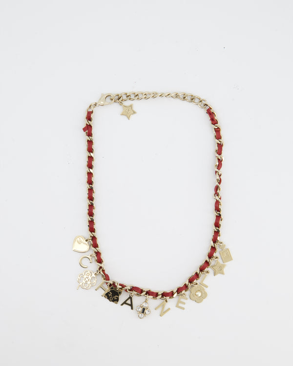 Chanel Necklace with a Red Leather-Woven Chain and Multiple Gold Charms