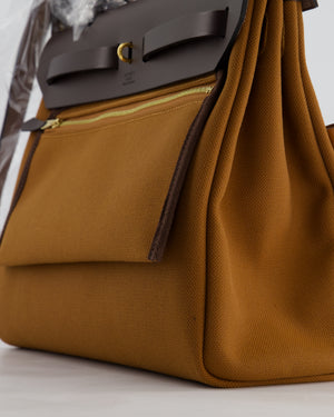 *SUPER HOT* Hermès Herbag 31 Zip Pocket Cargo Bag in Fauve Toile Militaire Canvas, Ebene Vache Hunter Leather with Gold Hardware