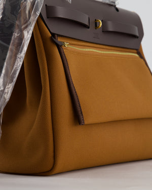 *SUPER HOT* Hermès Herbag 31 Zip Pocket Cargo Bag in Fauve Toile Militaire Canvas, Ebene Vache Hunter Leather with Gold Hardware