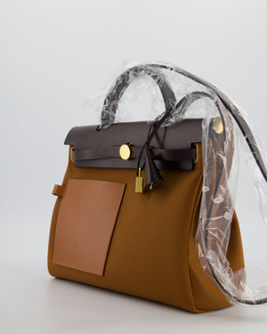 *SUPER HOT* Hermès Herbag 31 Zip Pocket Cargo Bag in Fauve Toile Militaire Canvas, Ebene Vache Hunter Leather with Gold Hardware