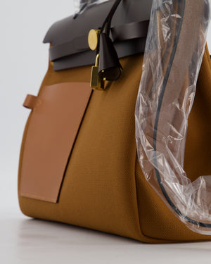 *SUPER HOT* Hermès Herbag 31 Zip Pocket Cargo Bag in Fauve Toile Militaire Canvas, Ebene Vache Hunter Leather with Gold Hardware