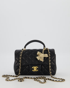 Chanel Black Mini Rectangular Top Handle Flap Bag in Lambskin Leather with Champagne Hardware and Strass Removable Bow Charm