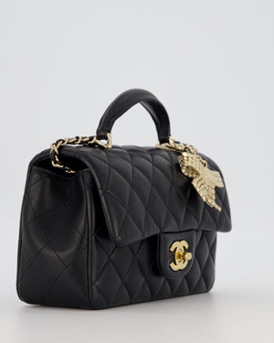 Chanel Black Mini Rectangular Top Handle Flap Bag in Lambskin Leather with Champagne Hardware and Strass Removable Bow Charm