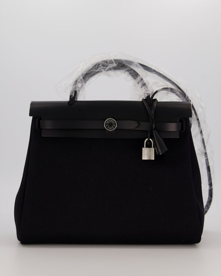 Hermès Herbag 31 Zip Bag in Noir Toile Officier Canvas, Noir Vache Hunter Leather with Palladium Hardware