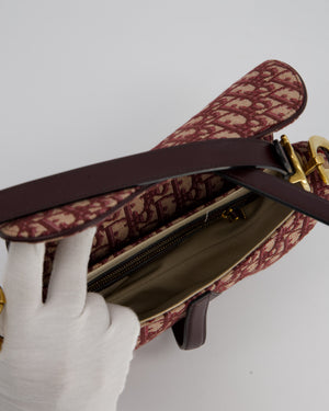 Christian Dior Medium Saddle Bag in Burgundy Oblique Canvas and Calfskin Leather with Gold Hardware and Studded Shoulder Strap