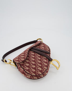 Christian Dior Medium Saddle Bag in Burgundy Oblique Canvas and Calfskin Leather with Gold Hardware and Studded Shoulder Strap