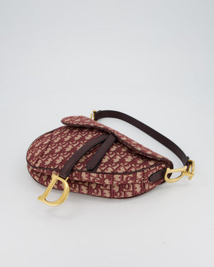 Christian Dior Medium Saddle Bag in Burgundy Oblique Canvas and Calfskin Leather with Gold Hardware and Studded Shoulder Strap