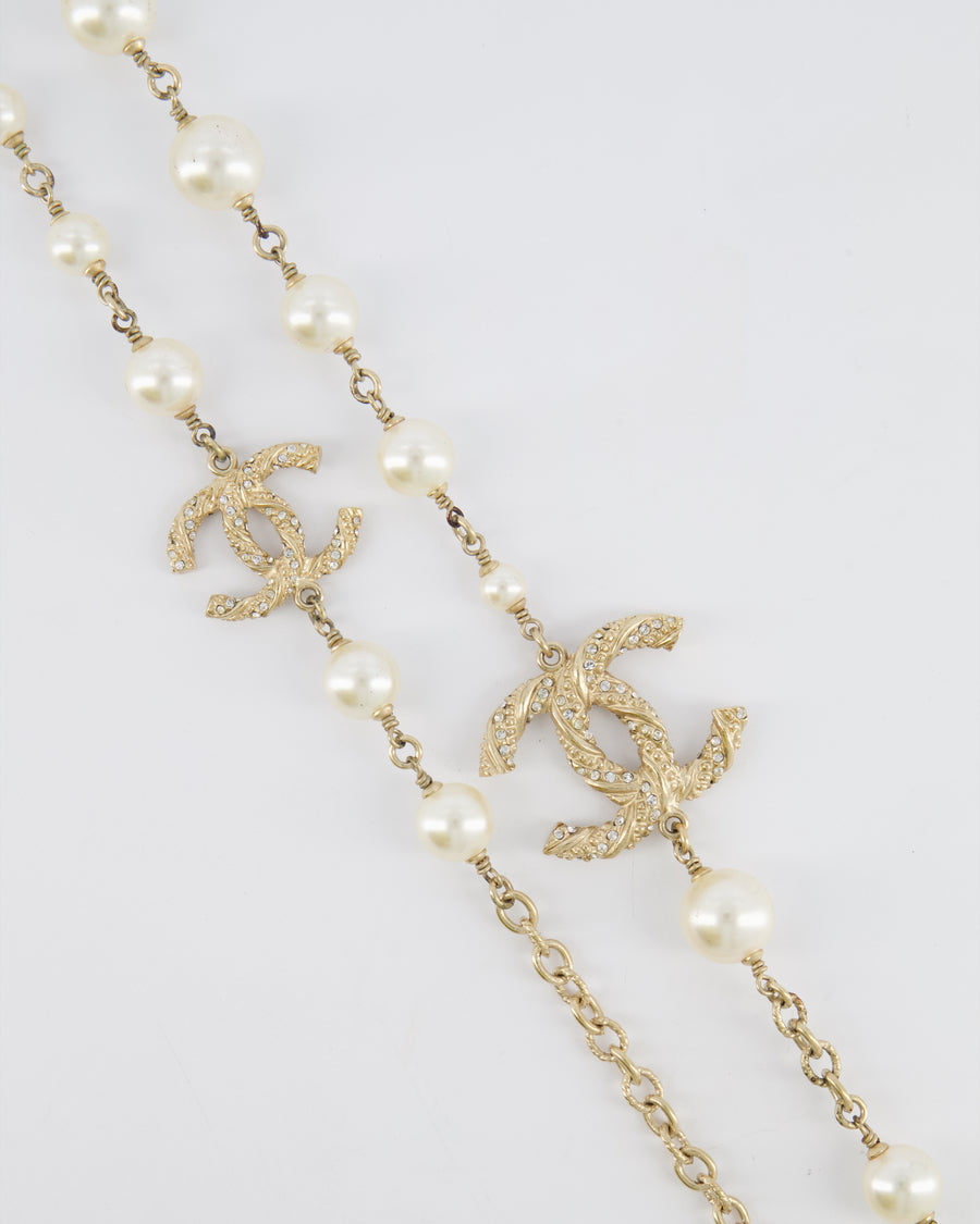 Chanel 15V Pearl Long Necklace with Gold Crystal Embellished Twisted CC Logo Detail