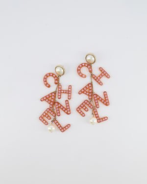 Chanel 18K Coral Pink Embellished Letter Drop Earrings with Pearl Details